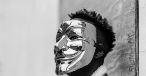 black activist wearing anonymous mask as sign of protest 1