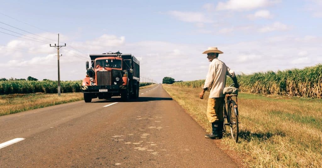 man with bicycle on road