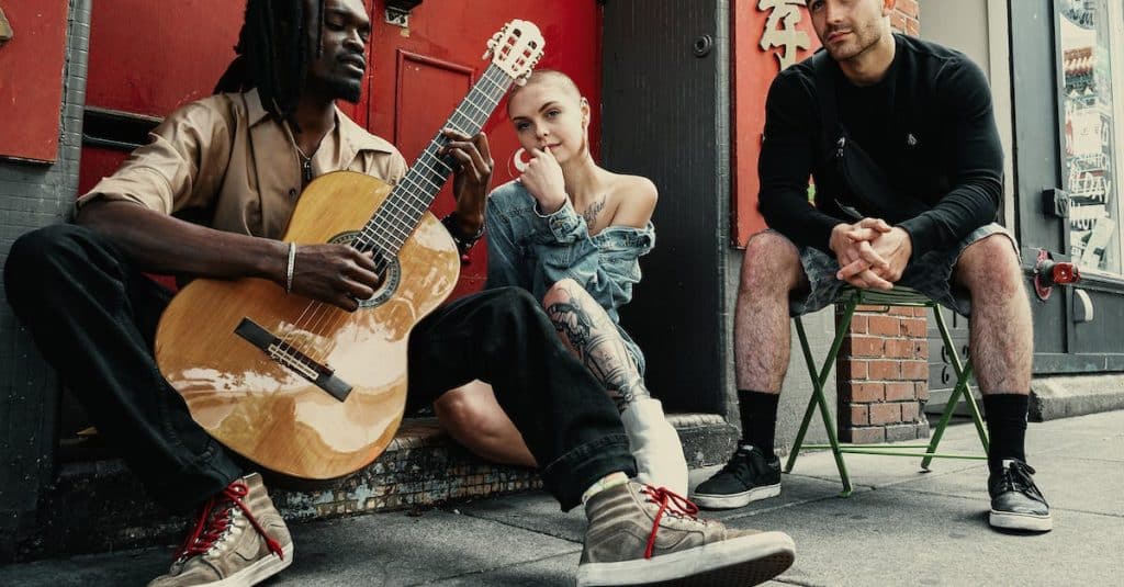 two-men-and-woman-sitting-next-to-each-other