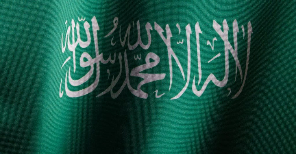 Boost Your Trades with the Bull Flag Pattern Strategy 10 detailed-close-up-of-the-saudi-arabian-flag-showcasing-the-elegant-arabic-script-and-vibrant-green-c